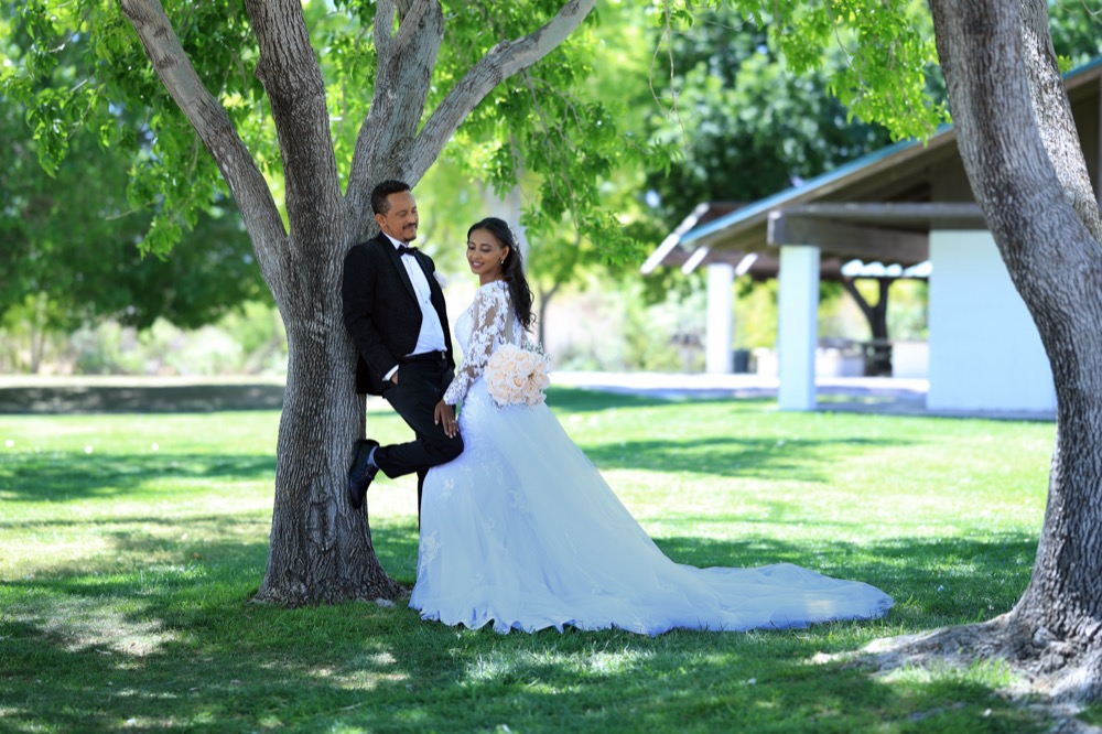 Wedding couple portrait under trees